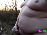 Chubby masturbates in the woods