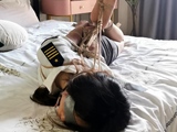 chinese hogtie on bed